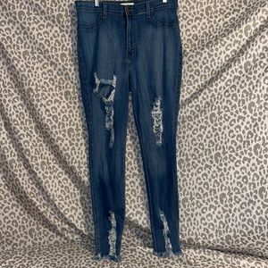 Vibrant gently worn high waist distressed skinny leg jeans